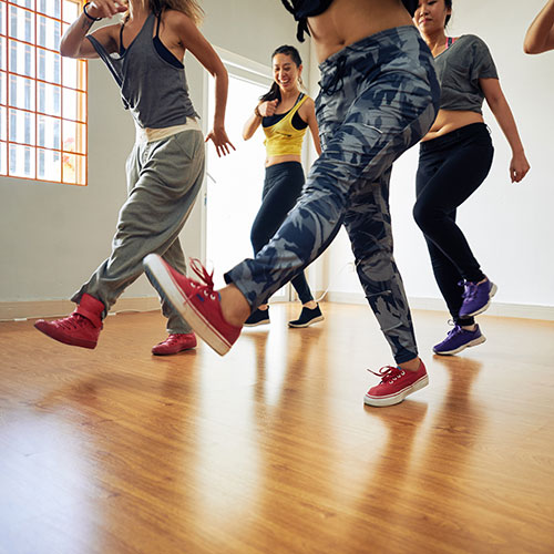 Hip Replacement Surgery - Group of Men and Women Workout Dancing in Gym